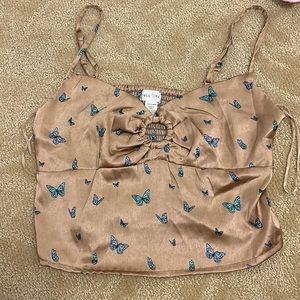 cute brown crop top with blue butterflies from Tilly’s